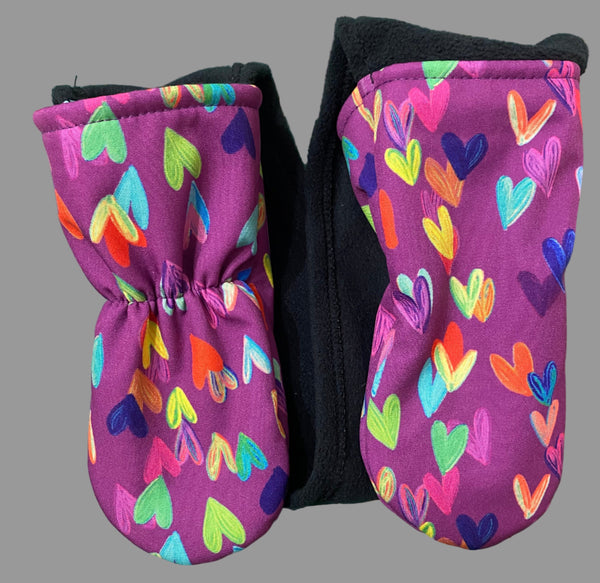 mittens kids can't take off with purple background and colourful hearts
